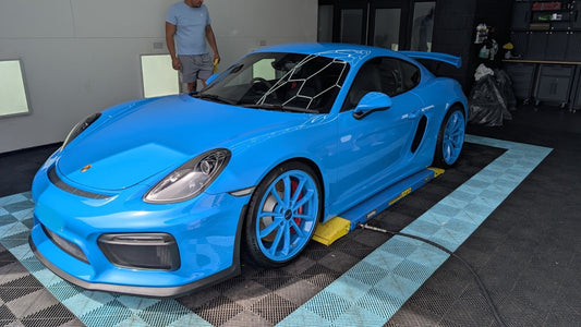 Blue Porsche Cayman GT4 with PSR9Line wheel spacers fitted