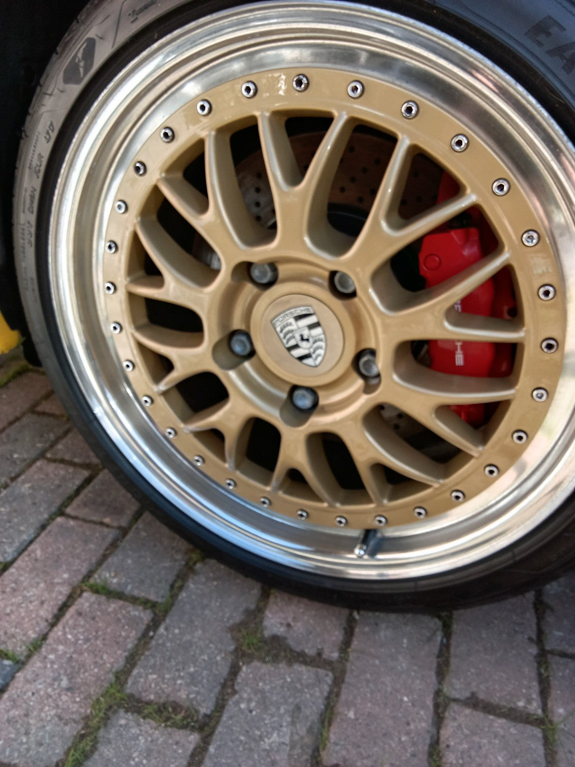 Porsche wheel fitted with PSR9Line wheel stud conversion setup